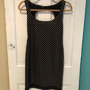 Sassy black mini dress with gold detail 🌟